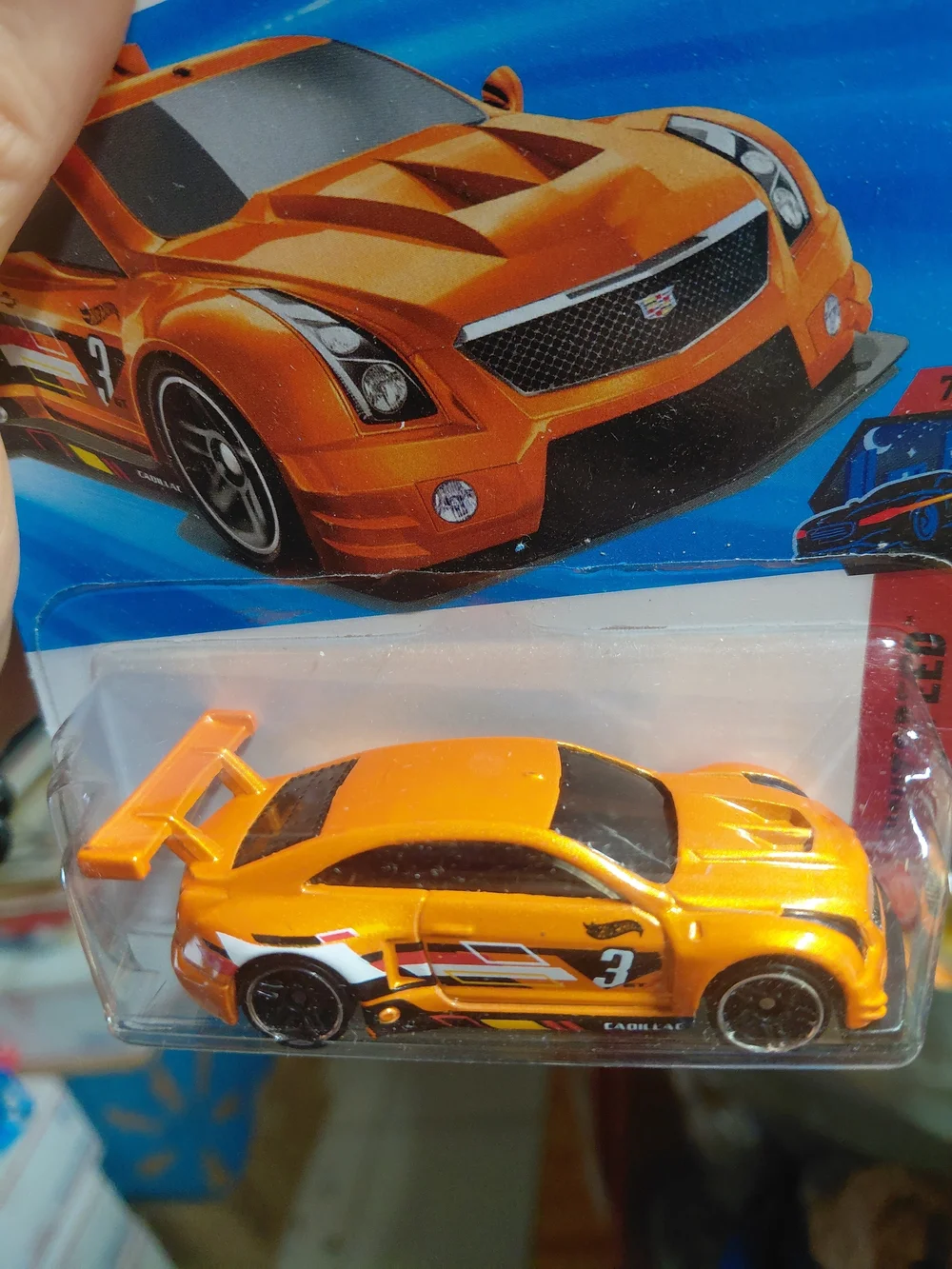 The Hot Wheels '16 Cadillac ATS-V R (orange, 90/250) is a 1:64 scale diecast car